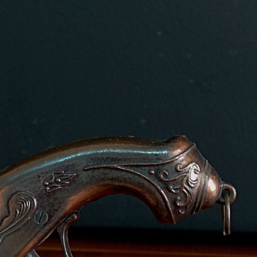 Vintage replica pistol used with engraved designs
