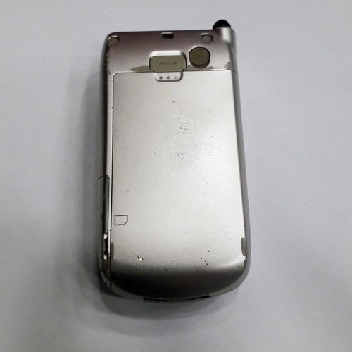 Sharp GX30 mobile phone used, silver, missing antenna part