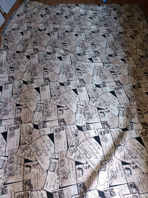 Sofa throws like new, 2 pieces with letters and stamps design