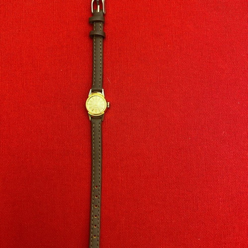 Wristwatch women's used, wind-up, metal, gold color, 1960s era