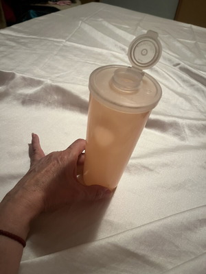 Tupperware shaker new, salmon color with double opening lid