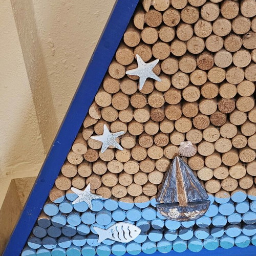 Sea-themed wall art with 600 corks and lighting