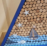 Sea-themed wall art with 600 corks and lighting