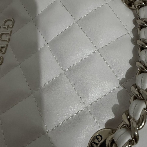 Guess Backpack white like new with silver details and charm