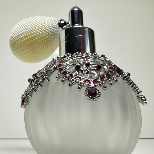 Vintage perfume bottle with pump, decorative hearts and crystals