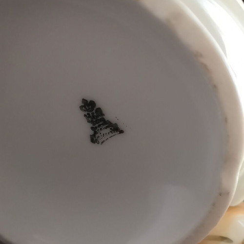 Porcelain teapot with opalescent surface and gold decoration