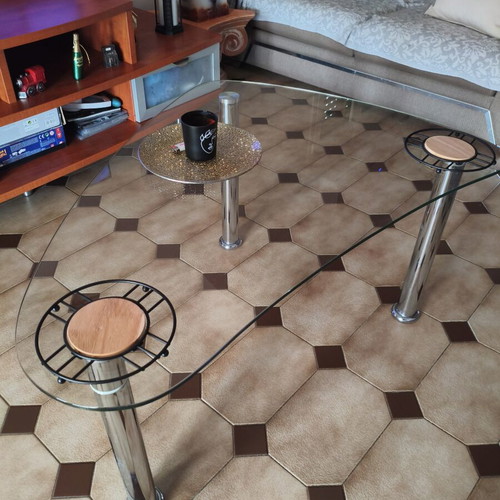 Glass coffee table with metal legs
