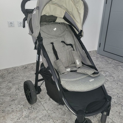 Joie Baby Stroller used with cup holders and waterproof hood