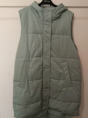 Sleeveless jacket mint color size Large like new