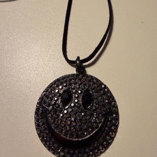 Long pendant like new with decorative emoji and black rhinestones