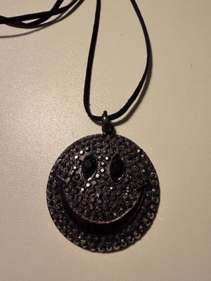 Long pendant like new with decorative emoji and black rhinestones
