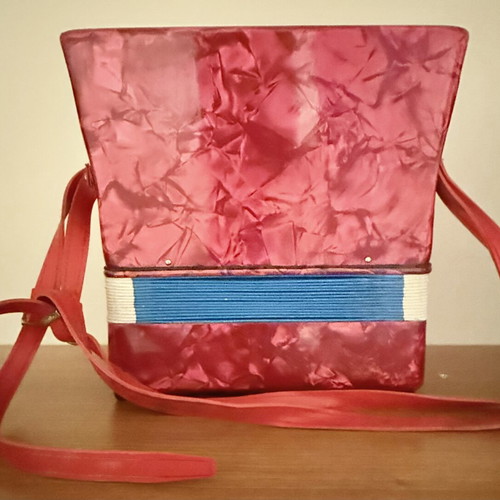 Children's accordion used, red with blue and red bellows