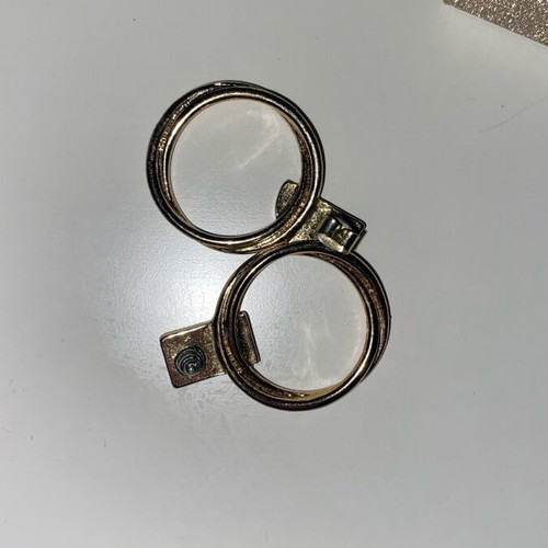 Gold hoop earrings used with detail on top part