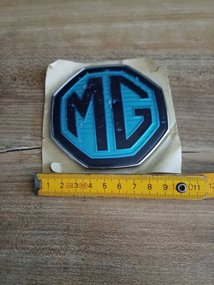 Genuine MG car badge like new with original membranes