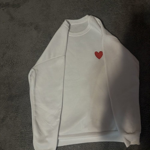 White sweatshirt with red heart