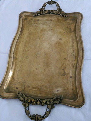 Vintage brass serving tray used with carved handles