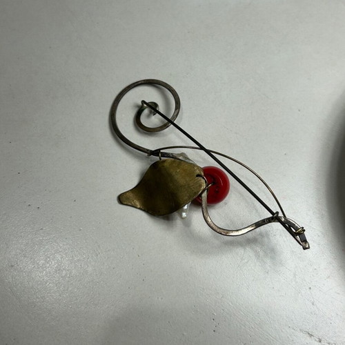Alternative metal pin used, red and gold colors