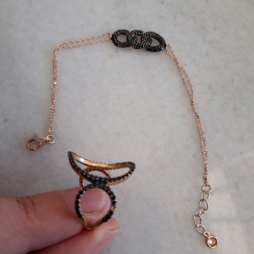 Silver set used with ring and black bracelet