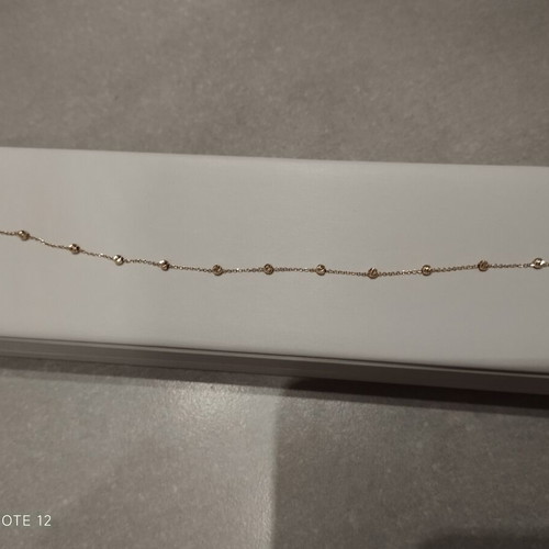 9k gold bracelet with diamond-studded beads
