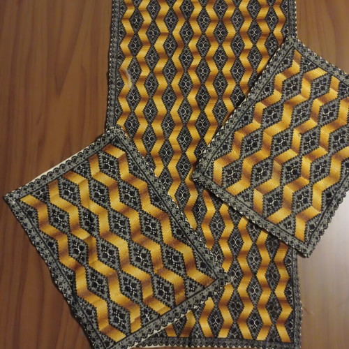 Handmade embroidered table linen set with 3D optical design