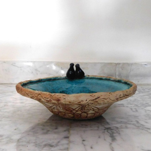 Decorative handmade ceramic plate with turquoise glaze, vintage, like new