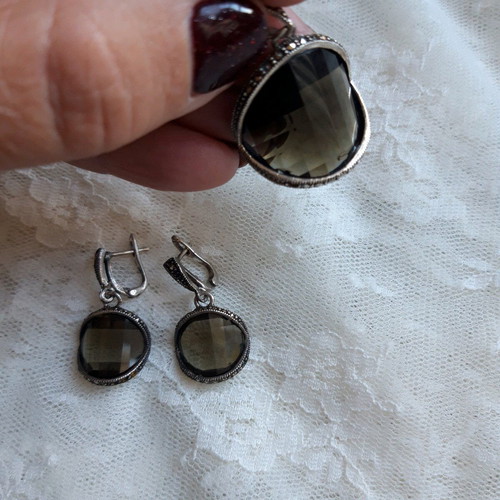 Silver set used with green transparent stones and marcasite