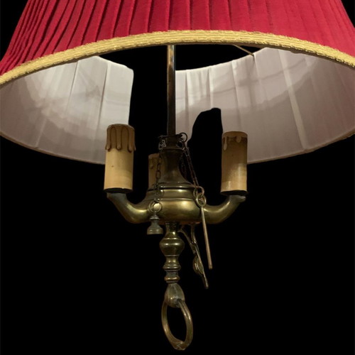 Vintage brass ceiling light with three lamps and red shade used