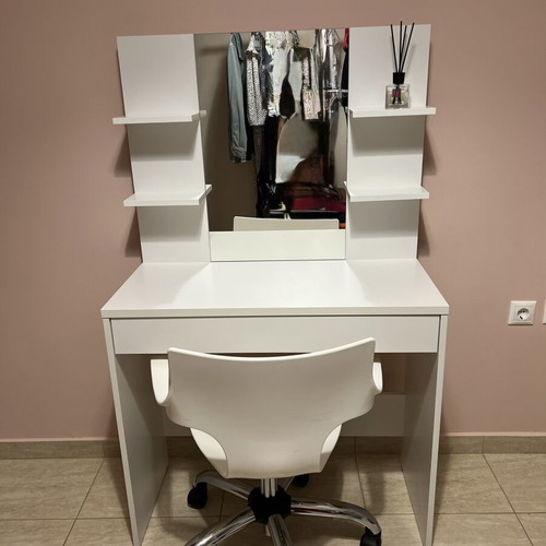 White makeup vanity table with drawer and shelves