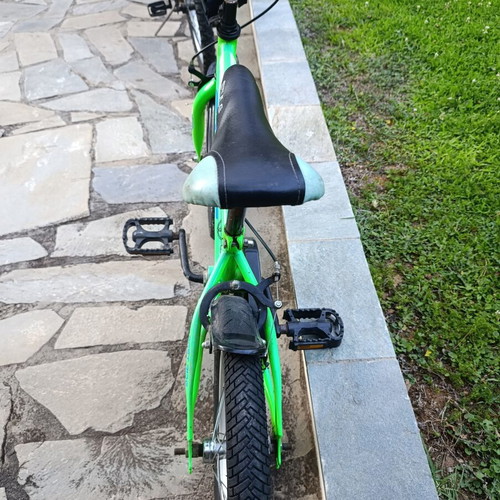 Style Challenger bicycle used, green with training wheels, ages 4-7