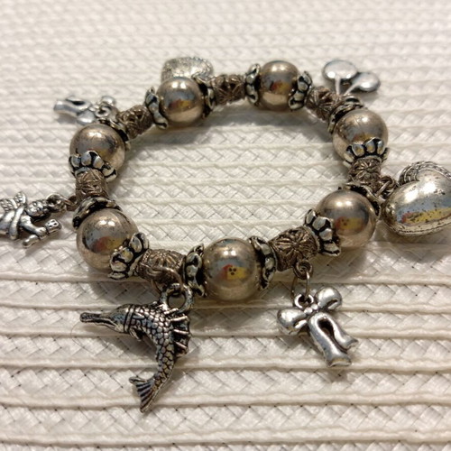 Bracelet with decorative charms like new, antique silver color