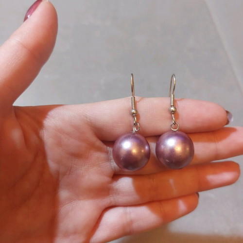 Dangling earrings used with purple and silver beads