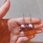 Dangling earrings used with purple and silver beads