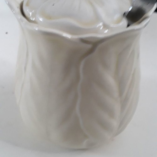 White porcelain sugar bowl used without spoon