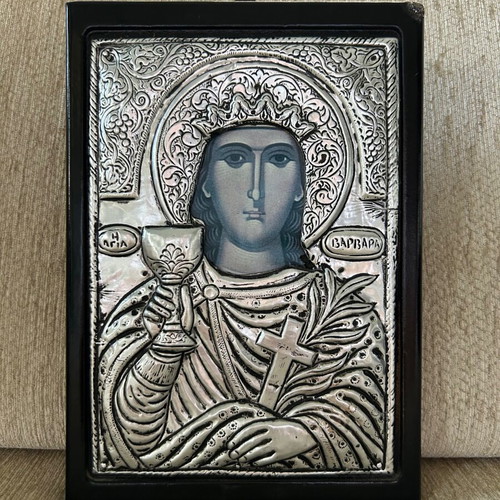 Religious icon used with metal overlay on wooden base