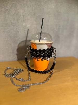 Cup holder handmade with black and silver beads