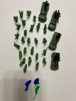 Small toy soldiers used, 26 soldiers, 3 Indians, 4 vehicles