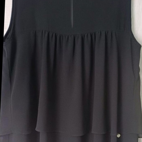 Sleeveless women's blouse black like new with ruffles and sheer detail
