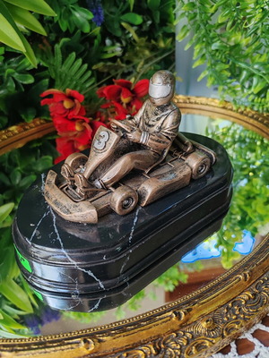 Vintage karting pilot trophy statue on black marble base