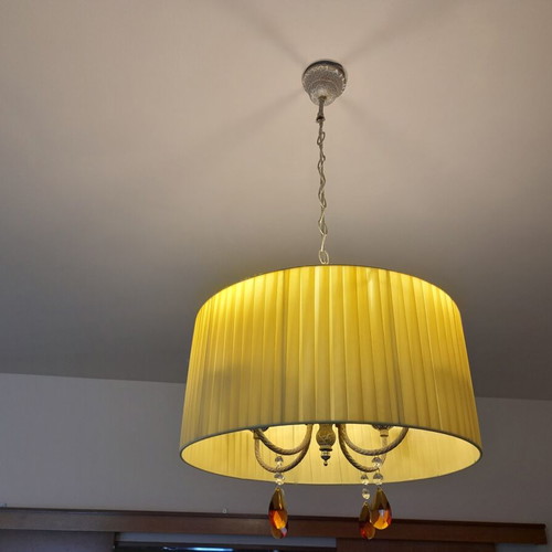 Ceiling light with brass parts and yellow lampshade
