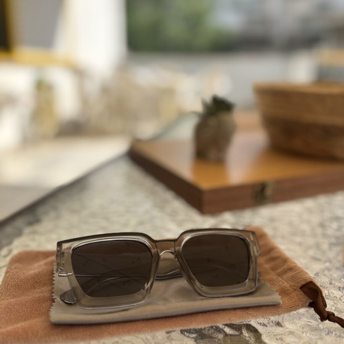 Sunglasses like new with gray semi-transparent frame, cloth and velvet case