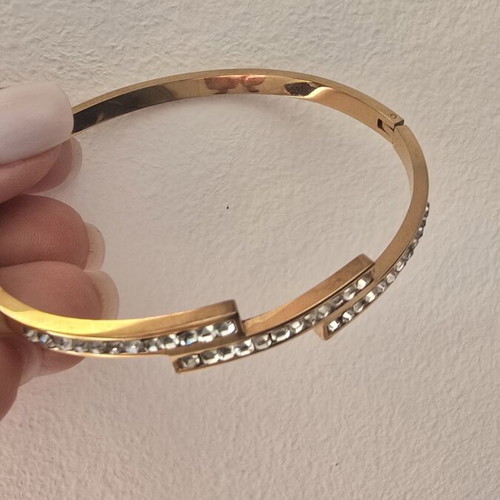 Steel bracelet in rose gold color with decorative stones, like new