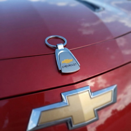 Car keychain set with solar light and valve caps, Chevrolet included