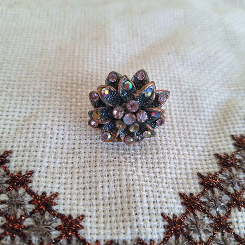 Bronze flower ring with pink rhinestones used
