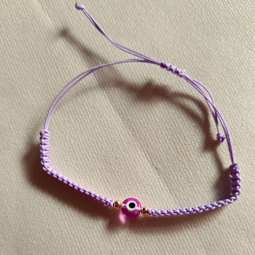 Woven bracelet with eye bead in lilac and fuchsia, new