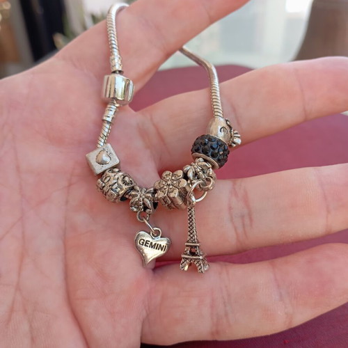 Steel bracelet with removable charms like new