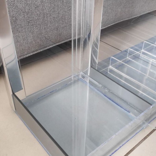 Tabletop plexiglass product display stand like new with metal decorations