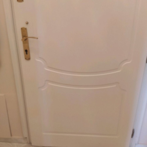 Lacquered entrance door used, terracotta exterior, white interior