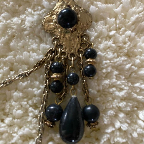 Vintage double brooch like new, gold color with black stones