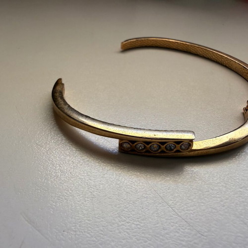 Gold-tone bracelet with white stones
