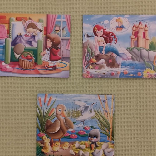 Wooden and paper puzzles used for children